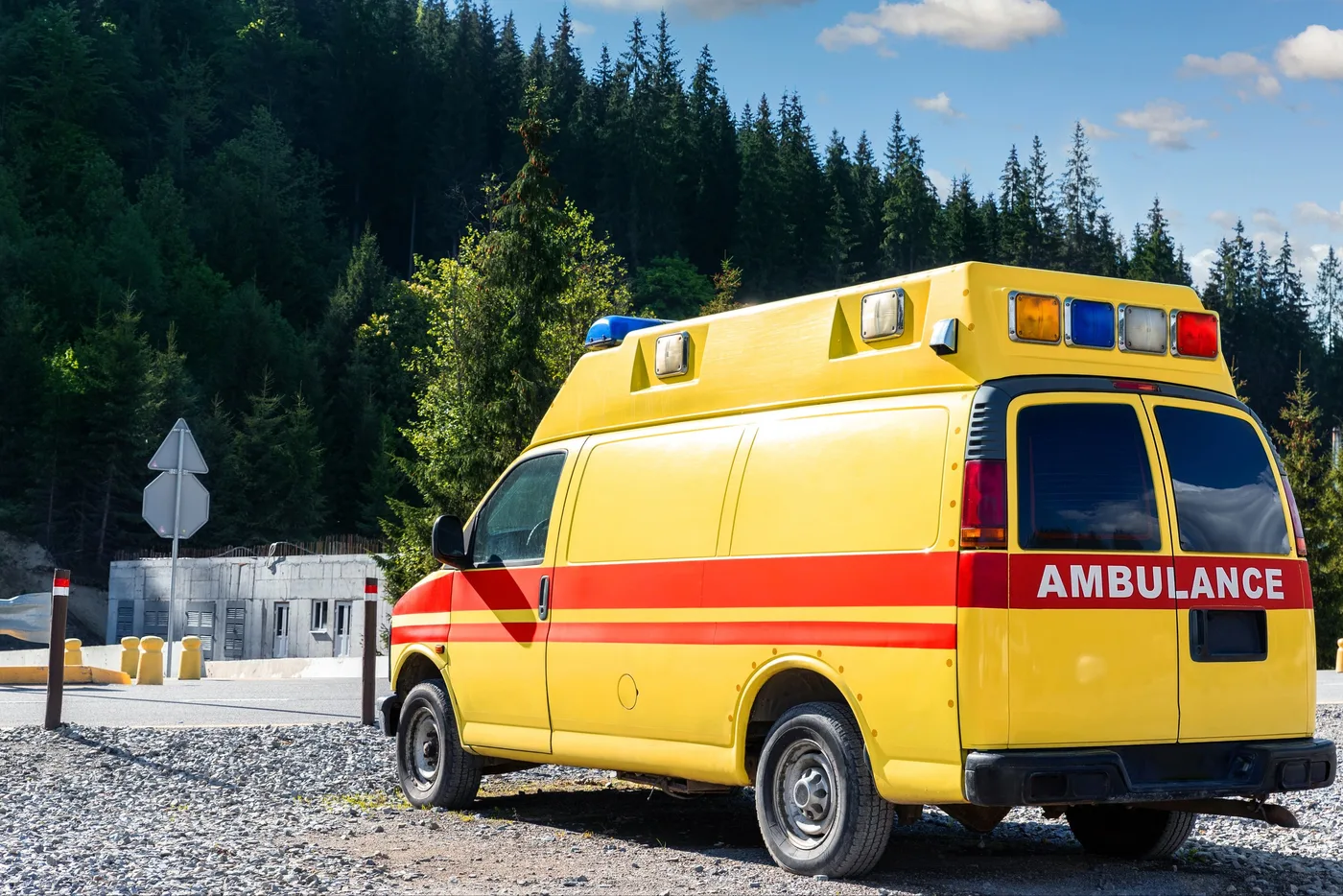 Side view of a yellow ambulance