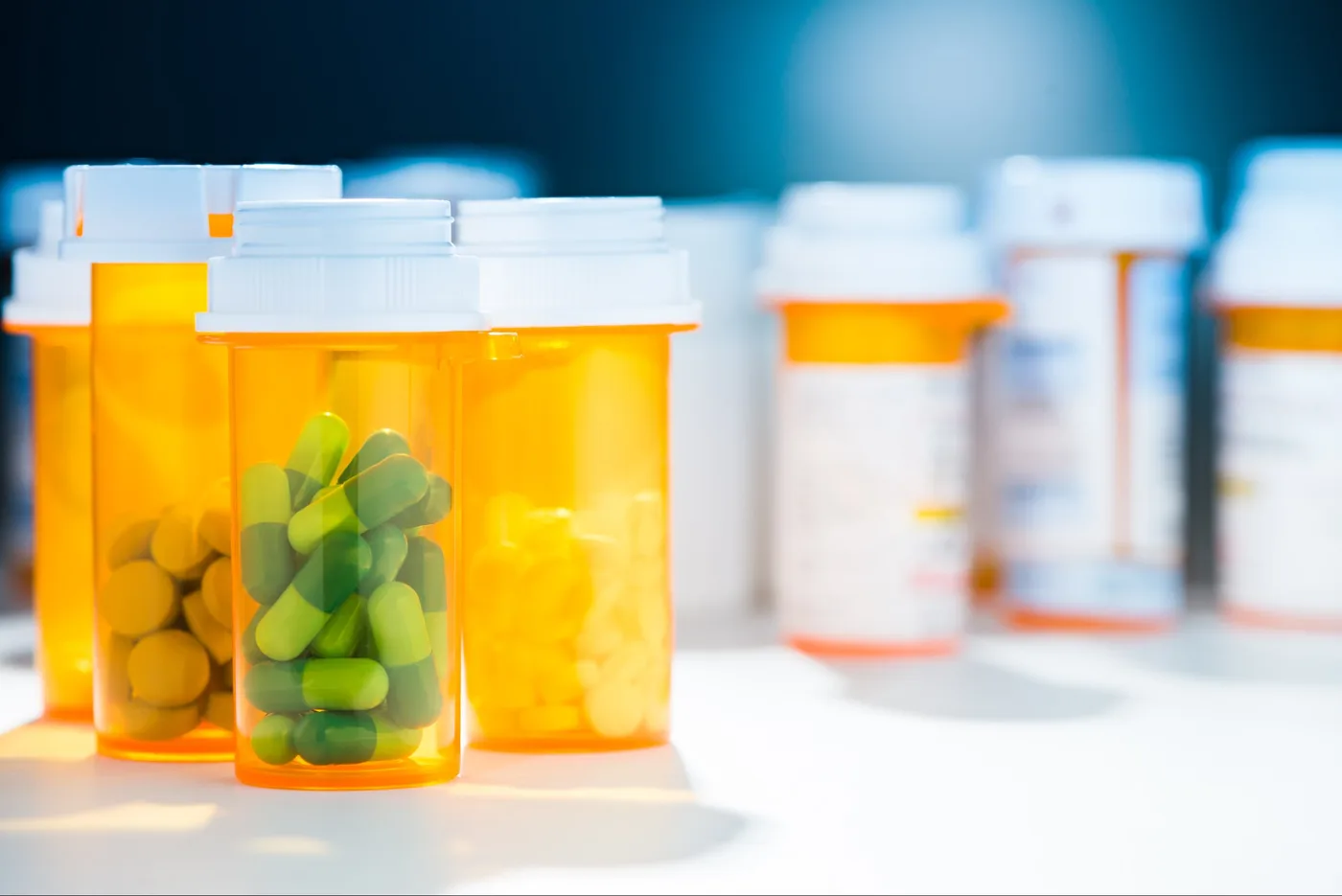Numerous pill bottles of different prescription capsule tablet pill medicine