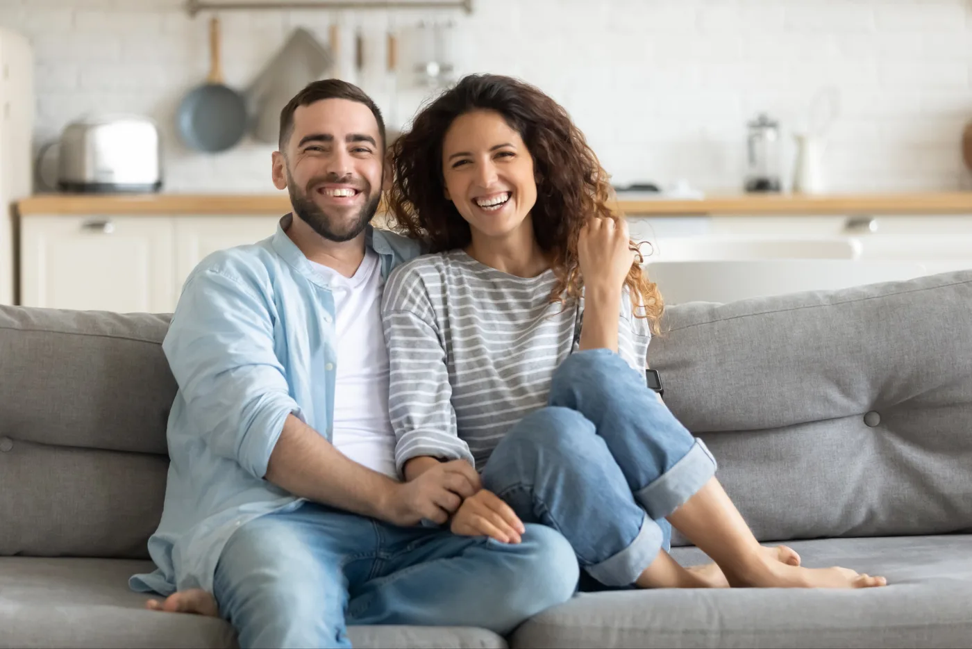 Happy couple looking at camera