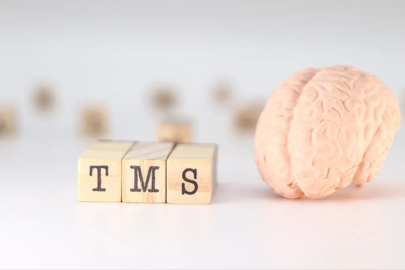 TMS Acronym Transcranial magnetic stimulation concept with brain